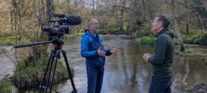 westcountry rivers trust ceo speaks with bbc reporter next to a river